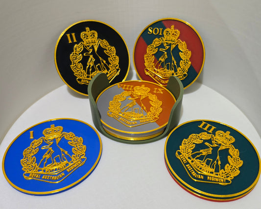 Set of five round emblems with different designs on a white surface
